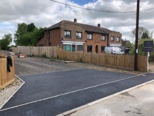 Tarmac driveway at a brick house