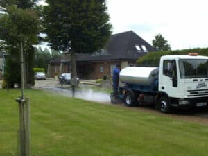 Tanker spraying a private drive ahead of surfacing