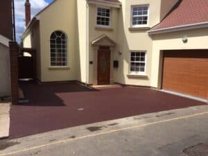 Red asphalt driveway at a new-build house