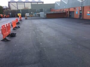 Resurfaced commercial carpark with safety barriers